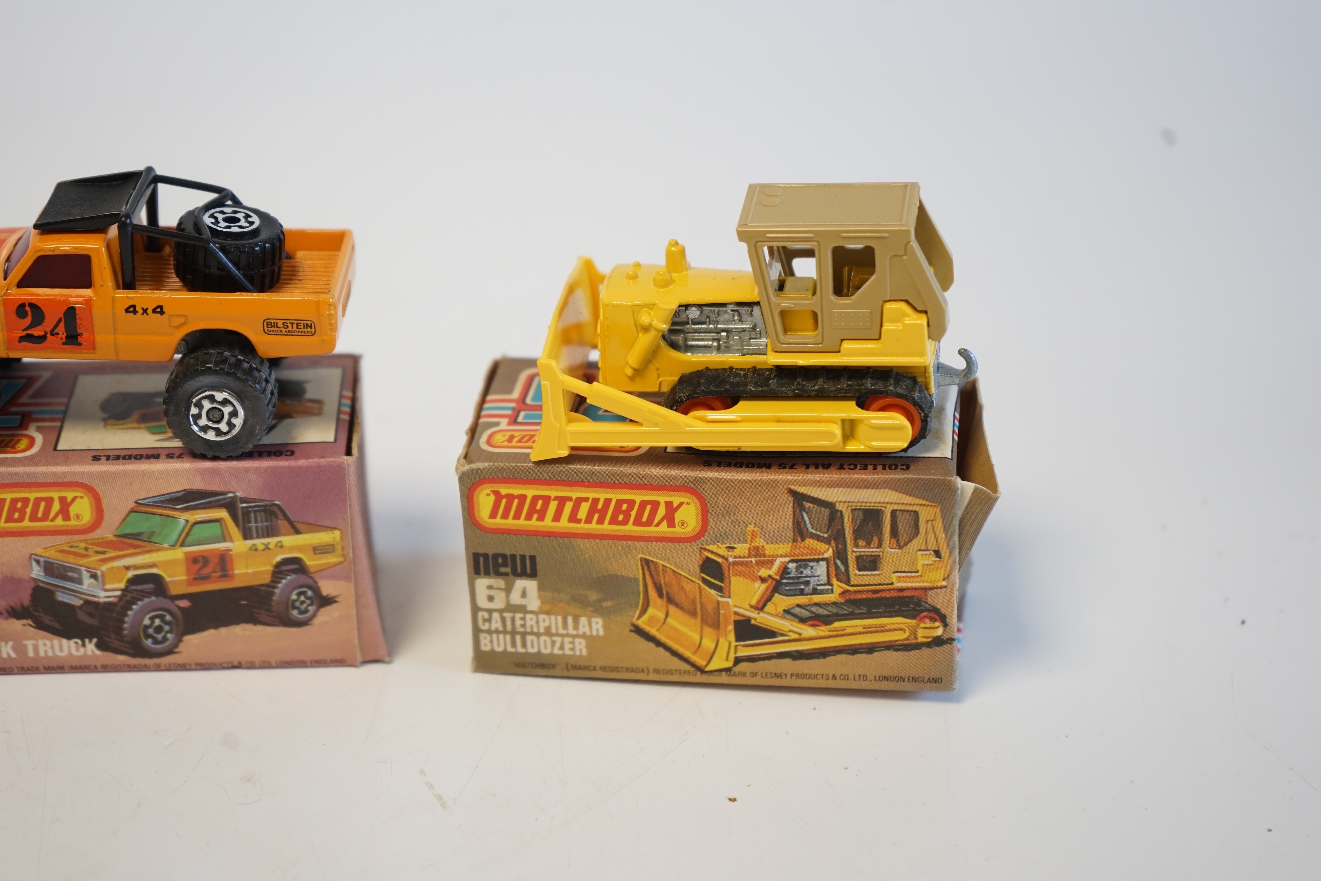 Eighteen boxed Matchbox Series 1-75 diecast vehicles including; 1; Dodge Challenger and another, 9; Ford RS 2000 and another, 10; Plymouth Police Car and another, 14; Petrol Tanker and another, 26; Site Dumper, 28; Formu